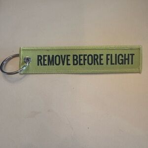 Yellow Keychain with 'Remove Before Flight' Tag